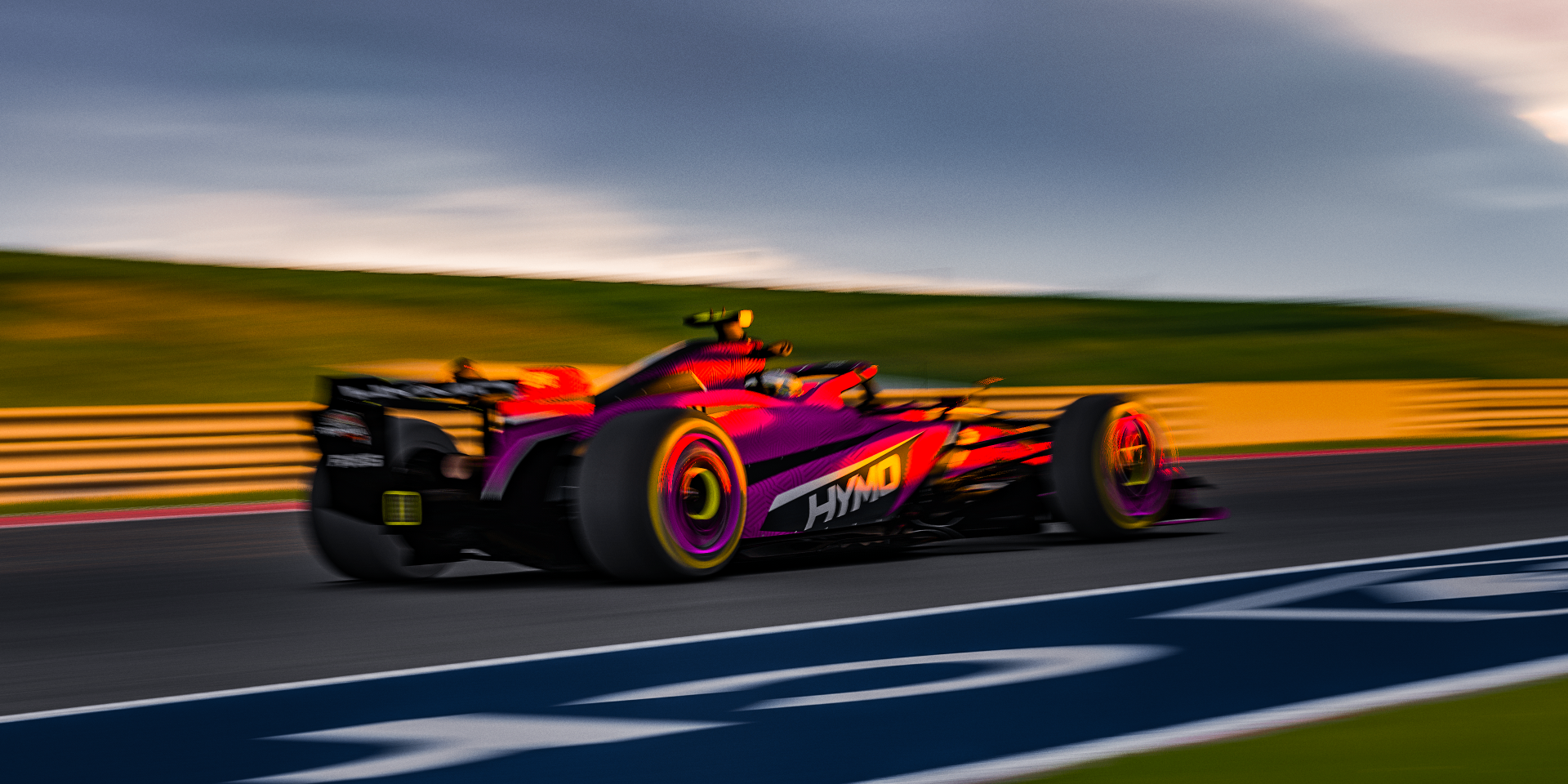 HYMO F1 car through COTA at dusk